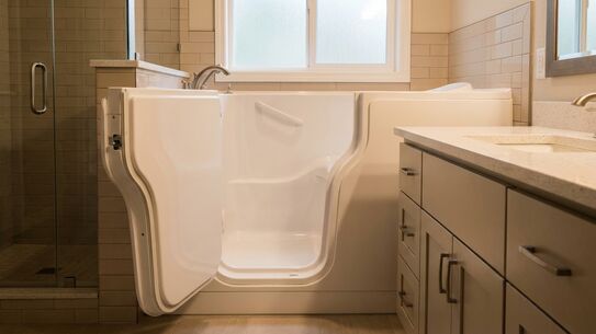 Walk-in tub with the door open, showing the low step-over entry